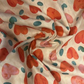 Bomulds stof med hjerter p� sandfarvet baggrund - pr. 0,25 m