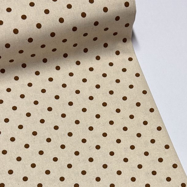 Fast bomuldsstof i lys beige med prikker i brun sukker - pr. 0,25 meter 