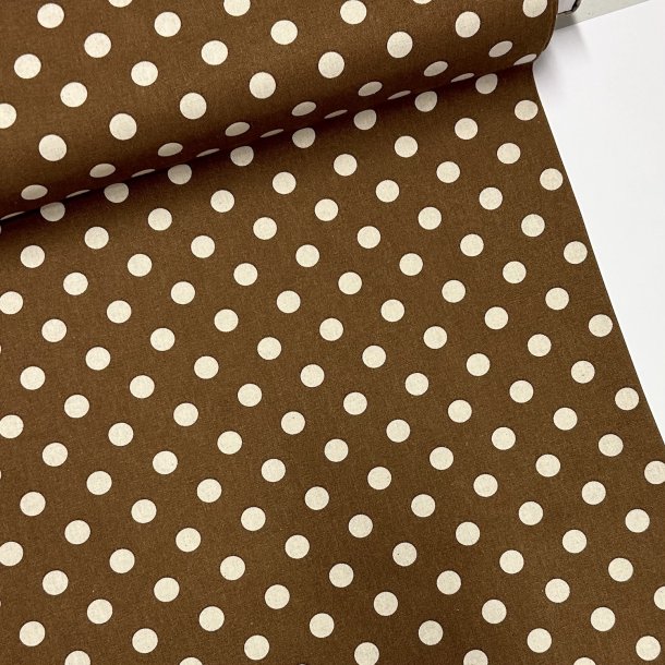 Fast bomuldsstof i brun sukker med polkaprikker - pr. 0,25 meter 