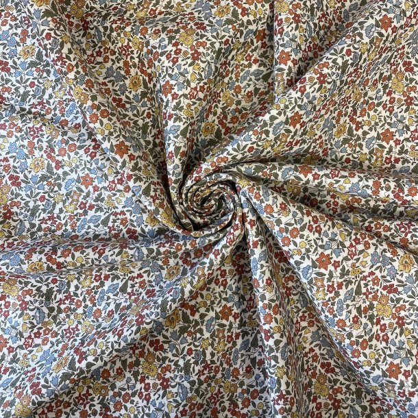 Liberty Stof med sm� blomster i karrygul, orange, bl� og gr�n p� hvid baggrund pr 0,25 m