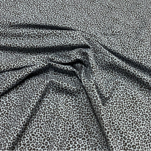 OEKO-TEX bomuldsjersey i bl med sorte leopardpletter - pr. 0,25 meter.