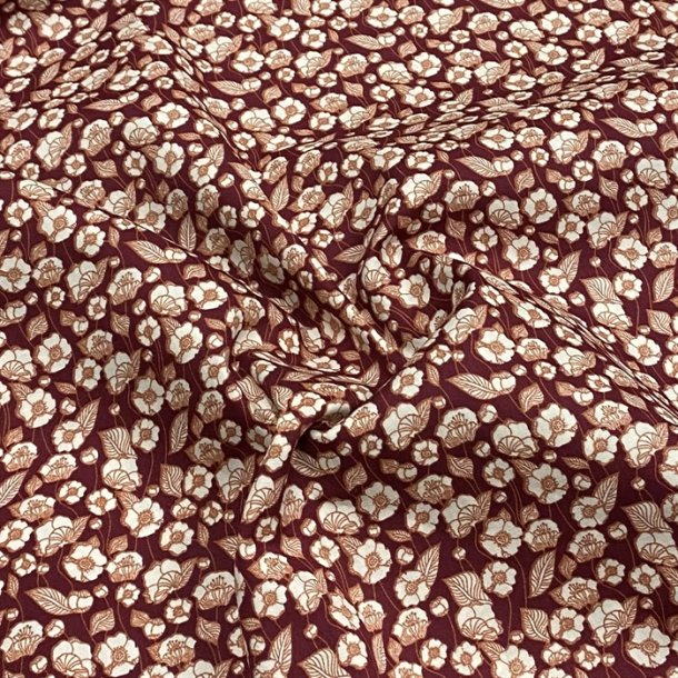 Bomuldspoplin i mrkerd med lyse blomster - pr. 0,25 meter