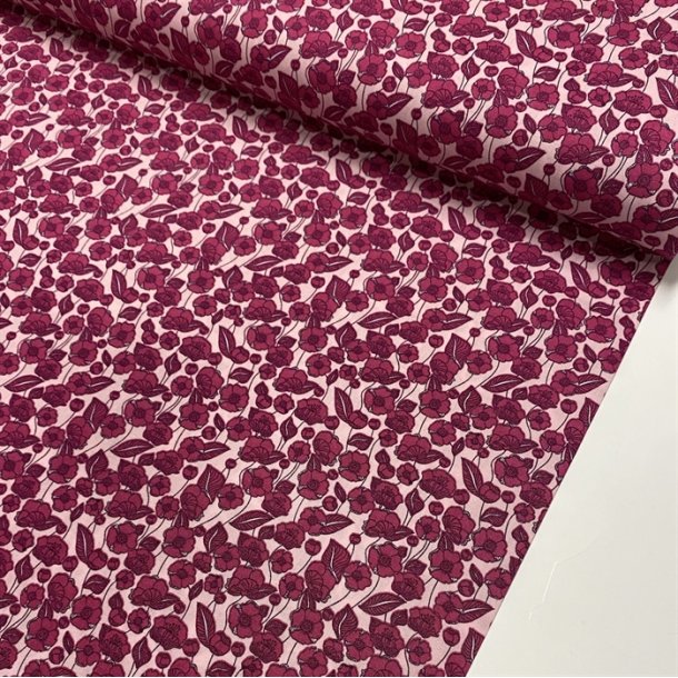 Bomuldspoplin i sart rosa med mrkrosa blomster - pr. 0,25 meter