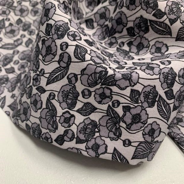 Bomuldspoplin i lysegr med mrkegr blomster - pr. 0,25 meter