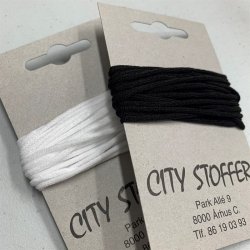 Elastik - tynd, rund og bl�d i hvid eller sort. Til fx mundbind