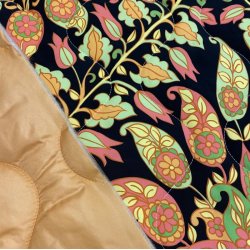 Quiltet polyester med orange paisley mnster - pr. 0,25 meter 