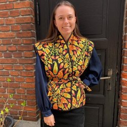 Quiltet polyester med orange paisley mnster - pr. 0,25 meter 