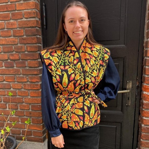 Quiltet polyester med orange paisley mnster - pr. 0,25 meter 