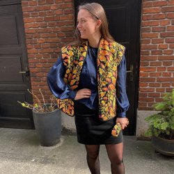 Quiltet polyester med orange paisley mnster - pr. 0,25 meter 