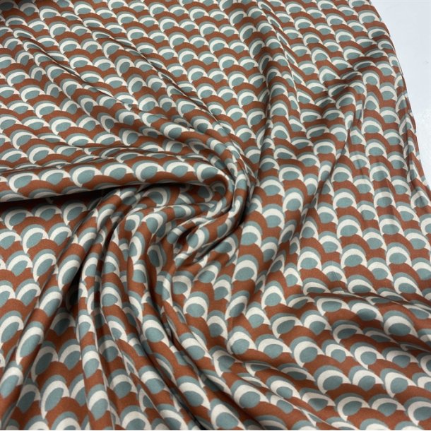 Orange viskose med buer i hvid og turkis - pr. 0,25 meter