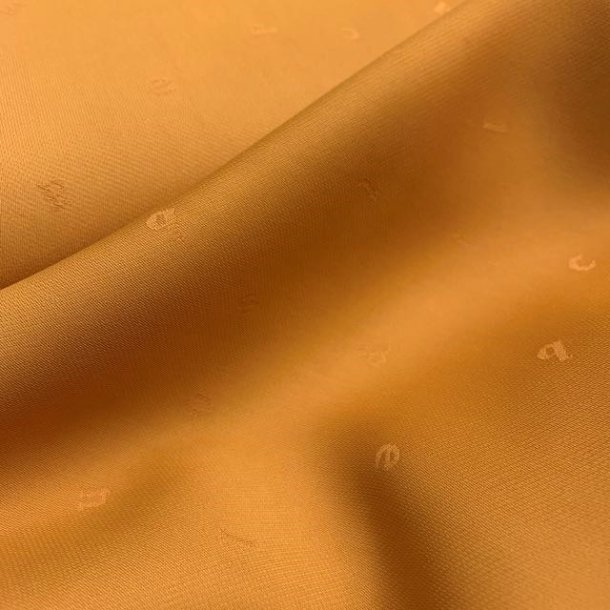 Viskose i sennepsgul med sm indvvede bogstaver - pr. 0,25 meter