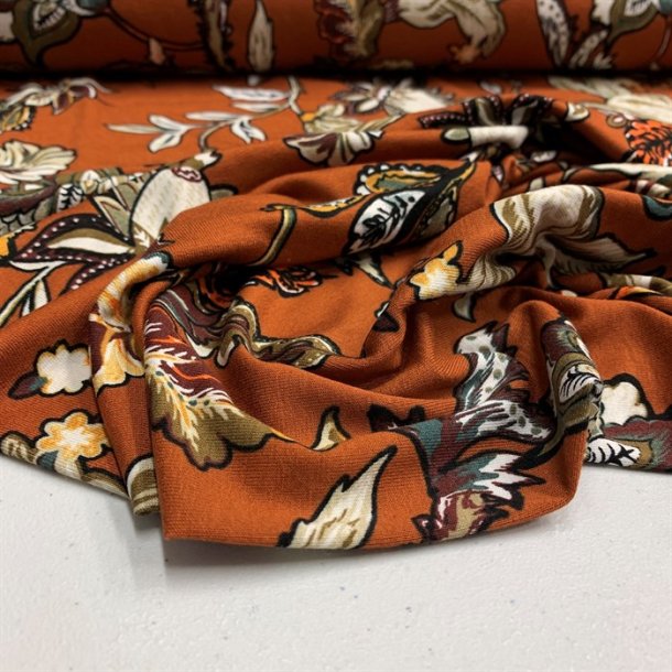 Viskosejersey i rust med blomster - pr. 0,25 meter