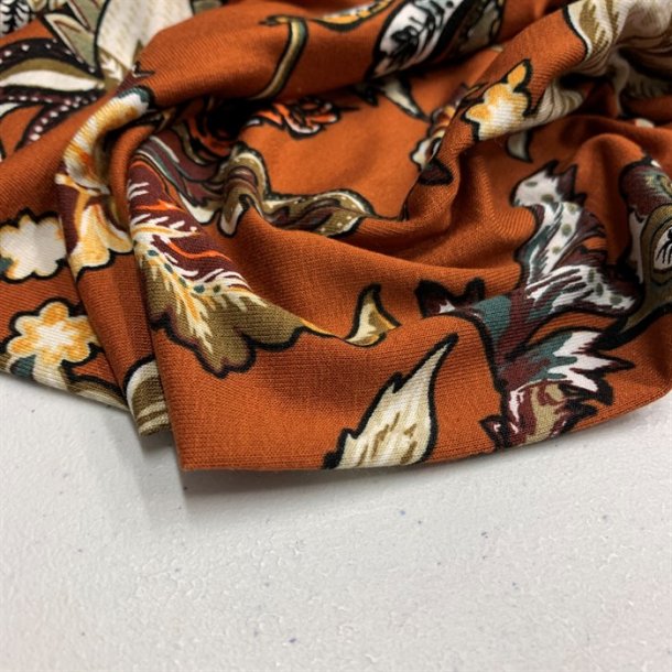 Viskosejersey i rust med blomster - pr. 0,25 meter