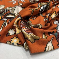 Viskosejersey i rust med blomster - pr. 0,25 meter